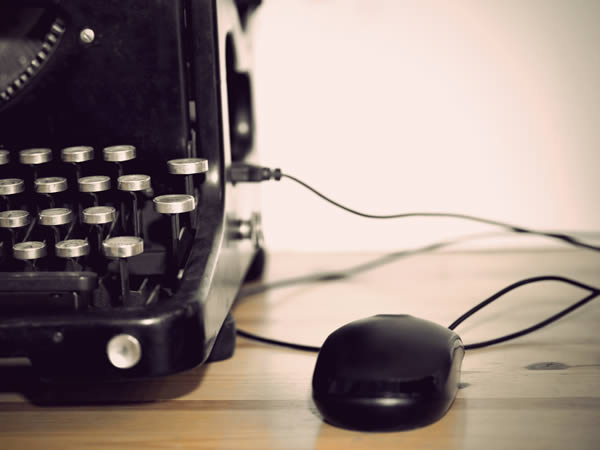 old fashioned typewriter with a mouse